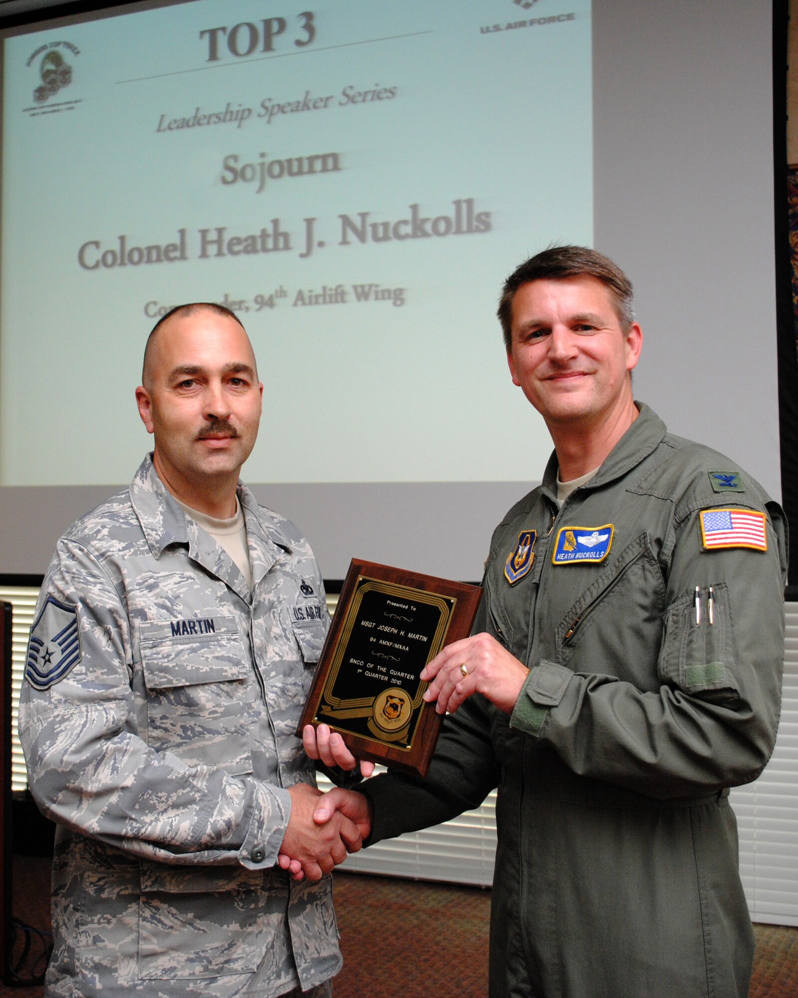 During the Top 3 meeting of the May drill weekend, Col. Heath Nuckolls, 94th Airlift Wing commander,  presented  Master Sgt. Joseph Martin with the Senior NCO of the  Quarter plaque for the 1st quarter of 2010.  Sergeant Martin serves with the 94th Aircraft Maintenance Flight as an aerospace maintenance craftsman.  (U.S. Air Force photo/Master Sgt. Stan Coleman)