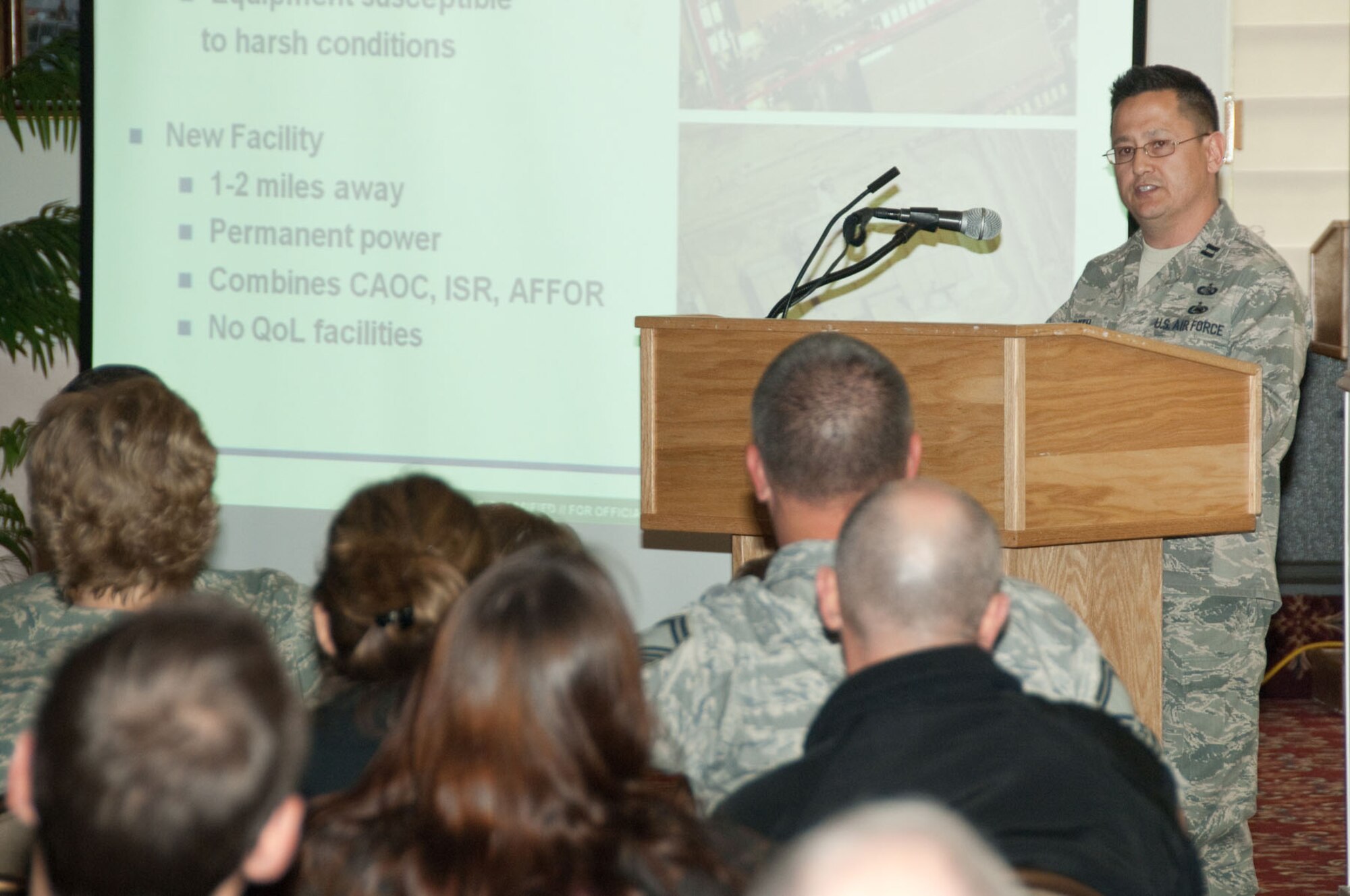 HANSCOM AIR FORCE BASE, Mass. - Capt. Dennis Smith talks about efforts, challenges and accomplishments during the combined air and space operations center installation and transition in Southwest Asia and the role of the Electronic Systems Center in that transition as part of the Heritage of Freedom event at the Minuteman Club on April 28. The Heritage of Freedom speaker series is held quarterly and features three speakers, each of whom discuss their experiences serving in combat or while deployed. Their hard-hitting 15 to 20 minute presentations are followed by short question and answer periods. (U.S. Air Force photo by Rick Berry)