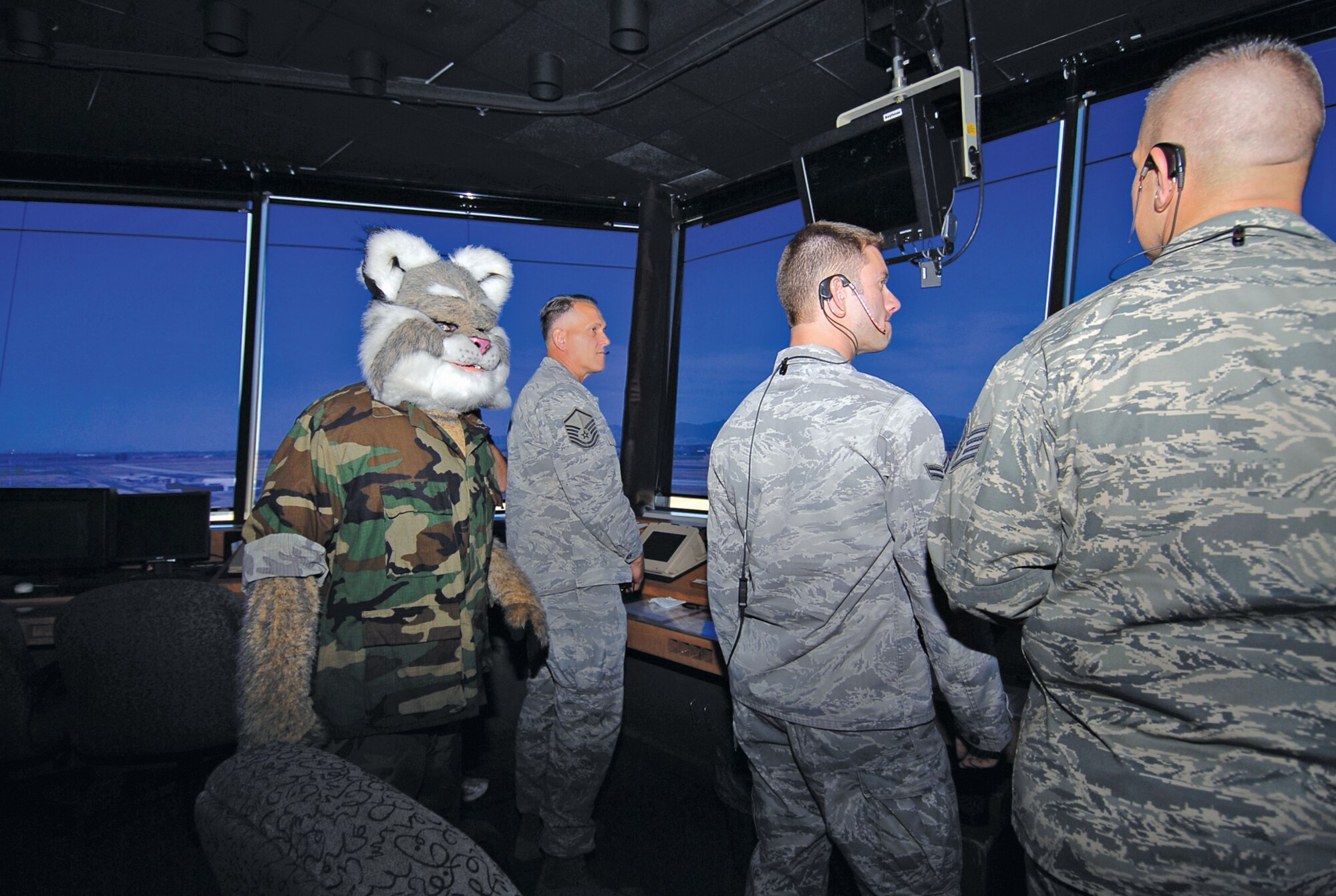 The Arizona Diamondbacks mascot Baxter visits Luke for video footage to show during Military Appreciation Day July 4 in the Air Traffic Control Tower of the 56th Operations Support Squadron Apr. 27. The Diamondbacks will be playing the Los Angeles Dodgers during the All-American Weekend.  (U.S. Air Force photo by Airman 1st Class Ronifel Yasay)
