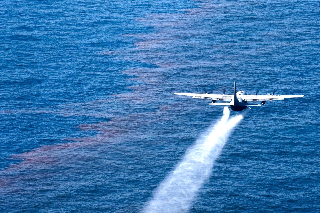 A C-130 Hercules from the Air Force Reserve Command's 910th Airlift Wing at Youngstown-Warren Air Reserve Station, Ohio, drops an oil-dispersing chemical into the Gulf of Mexico May 5, 2010, as part of the Deepwater Horizon Response effort. The 910th AW specializes in aerial spray and is the Department of Defense's only large-area, fixed-wing aerial spray unit. (U.S. Air Force photo/Tech. Sgt. Adrian Cadiz)