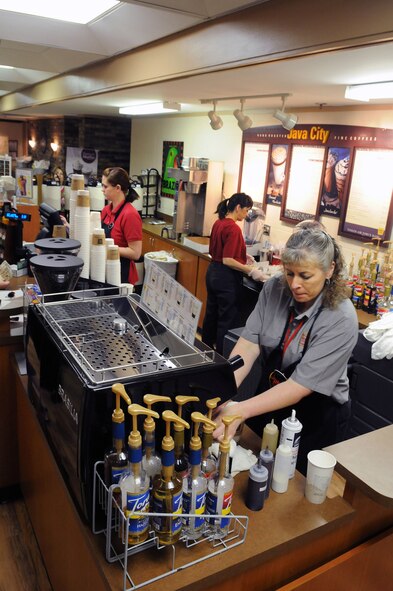 Java City employees Elizabeth Parramore, Milissa Stockton and Debby DeSha, from left, create specialty coffee drinks at the popular spot located in the Café 3001 restaurant of Bldg. 3001. The base dining facilities are part of the services provided by the 72nd FSS Sustainment Services Flight. (Air Force photo by Dave Faytinger)
