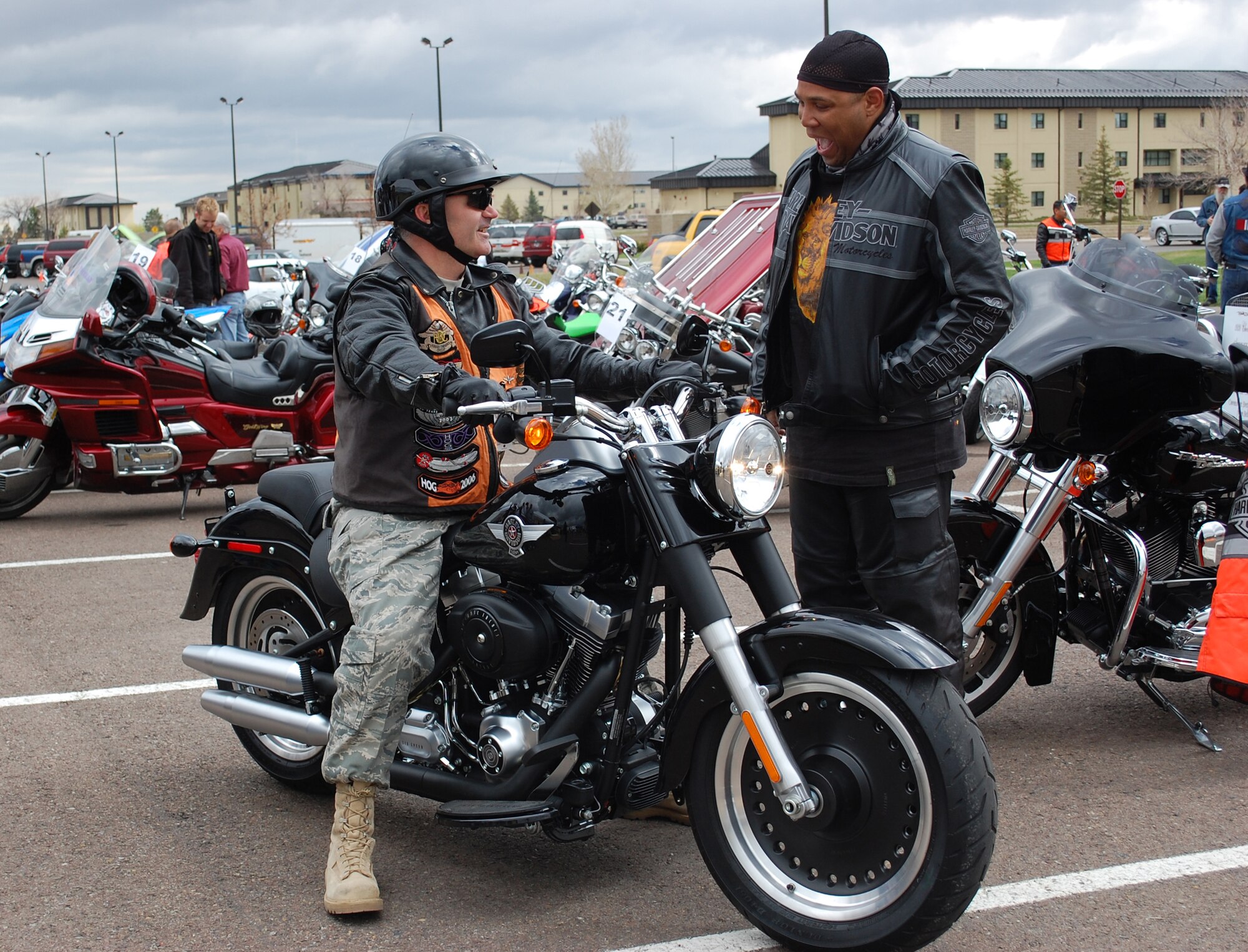 Col. Gregory Rosenmerkel, 819th RED HORSE Squadron commander, stops to chat with one of his staff members, Staff Sgt. Jason Joseph, when arriving at the motorcycle safety day. (U.S. Air Force photo/Valerie Mullett)