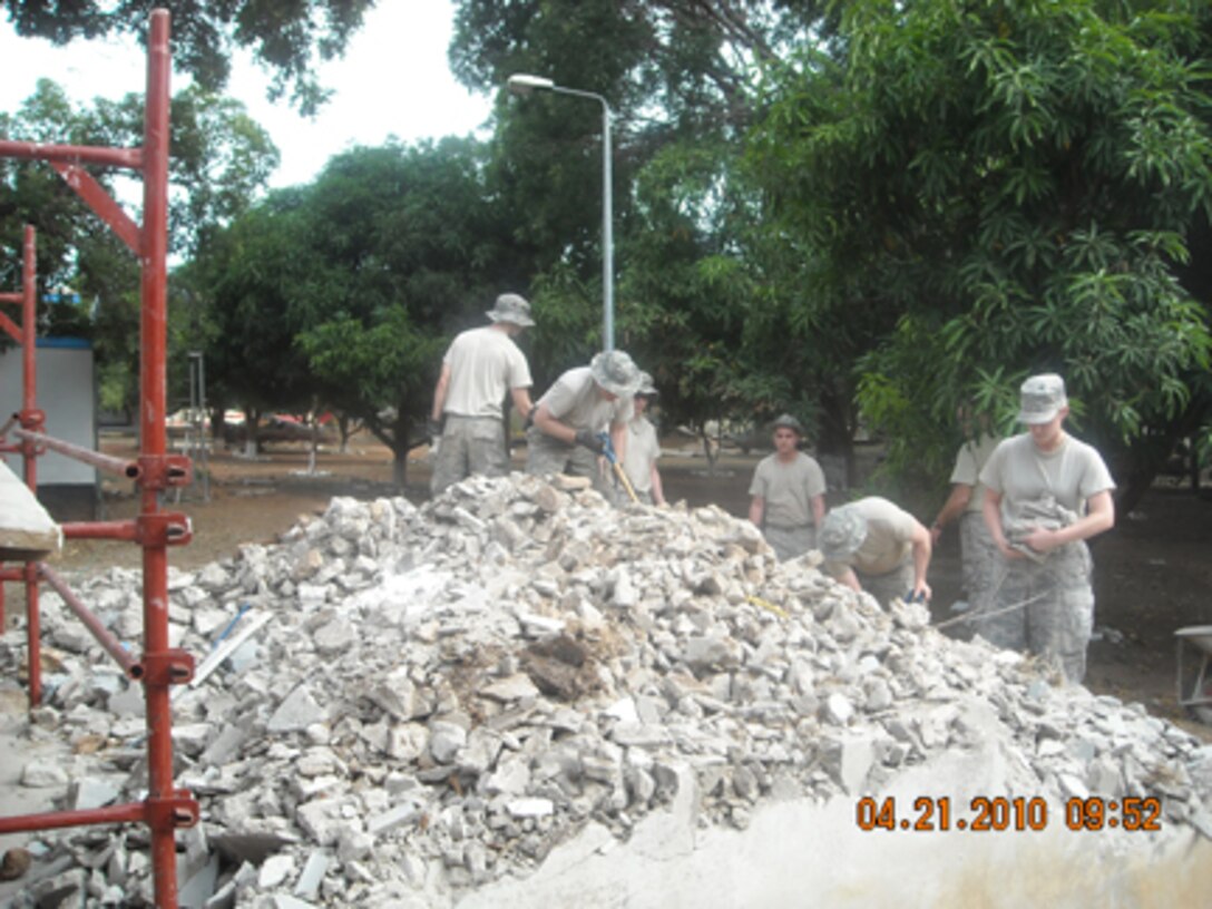 Senior Airman Derek Johansen, of Devils Lake, N.D., and other Airmen with the North Dakota National Guard’s 119th Wing Civil Engineer Squadron work on gutting a building in Accra, Ghana. The Airmen were on a two-week humanitarian mission as part of the Department of Defense-sponsored State Partnership Program. 