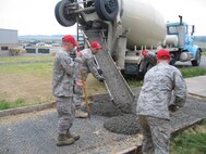 Airmen from the 567th Red Horse Squadron Structures Shop prepare to pour concrete to create a pad for a guard shack during their recent annual training. (USAF photo courtesy of 567 RHS)