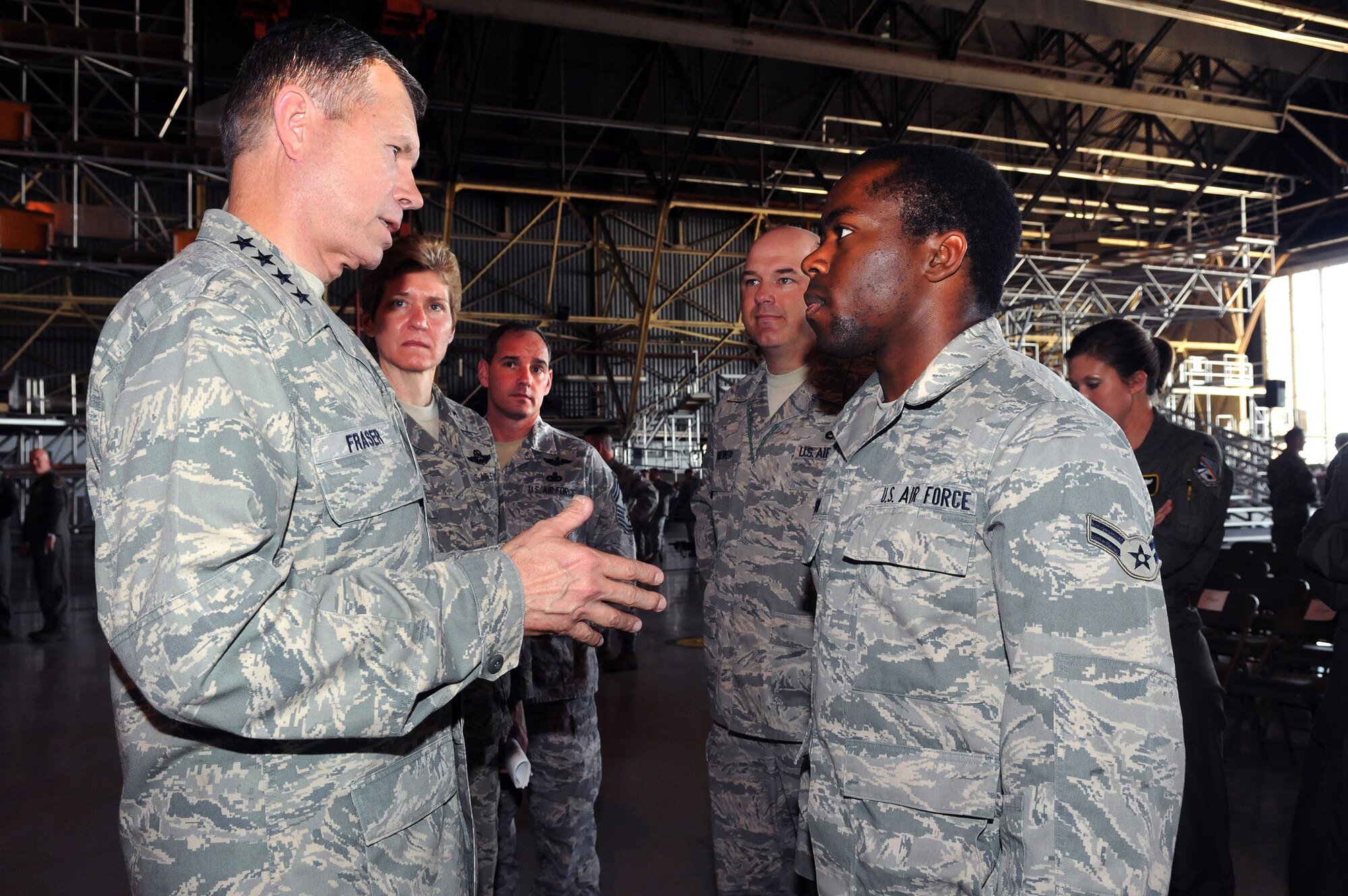 Gen. William M. Fraser III answers a question from Airman 1st Class Jonathan Wilson April 29, 2010, at Tinker Air Force Base, Okla. General Fraser is the commander of Air Combat Command. Airman Wilson is from the 552nd Aircraft Maintenance Squadron. (U.S. Air Force photo/Dave Faytinger)