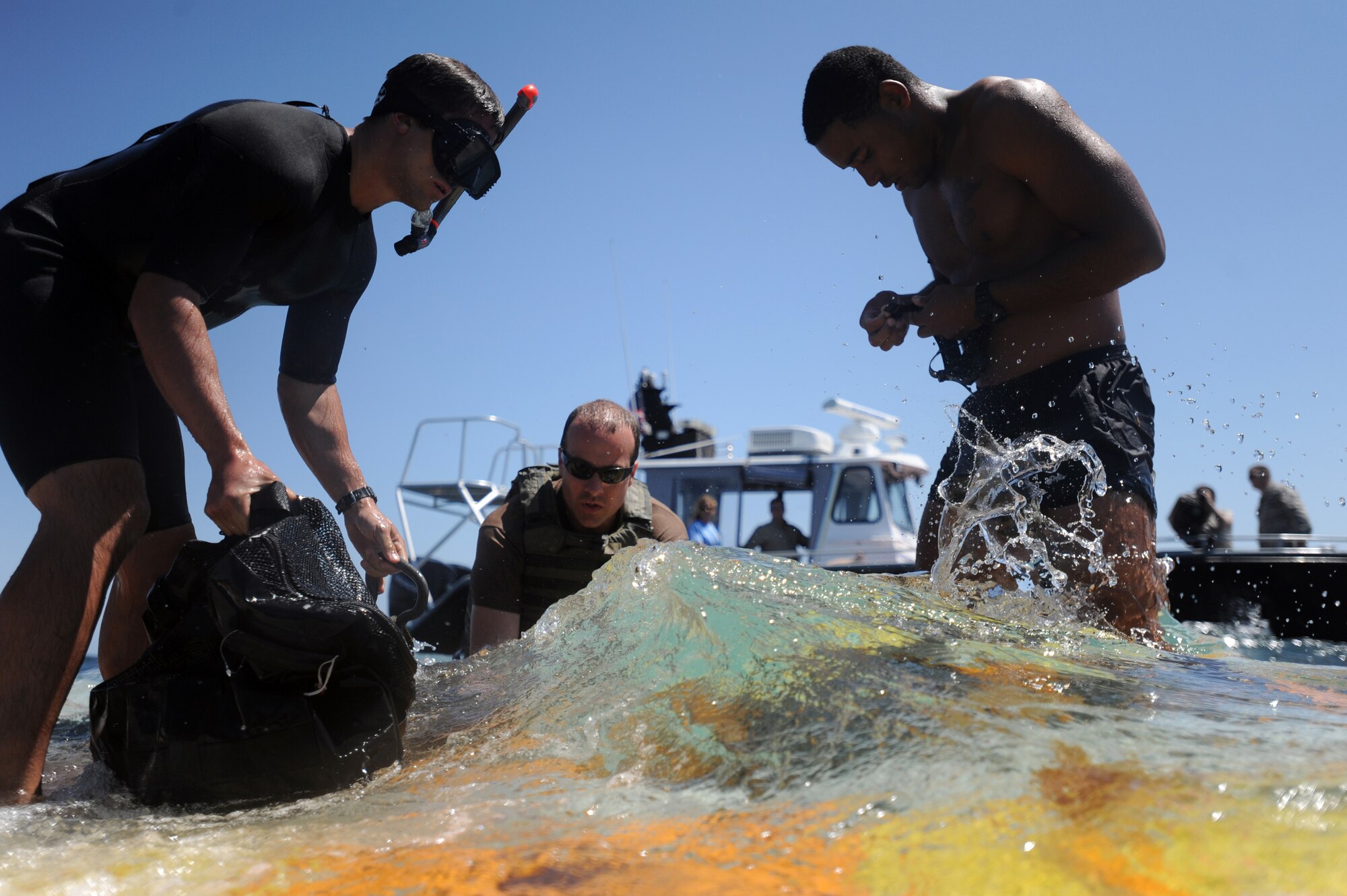 U.S. Navy Special Warfare boat operators from Special Boat Team 20 secure the platform in the Gulf of Mexico April 26, 2010. The platform held an inflatable boat from SBT-20, home-ported at Joint Expeditionary Base Little Creek, Va., and was dropped into the ocean by an MC-130H assigned to the 15th Special Operations Squadron at Hurlburt Field, Fla., as part of joint training conducted by the maritime training division of the 1st Special Operations Support Squadron Range Support Flight from Hurlburt Field. (DoD photo by U.S. Air Force Senior Airman Matthew Loken)