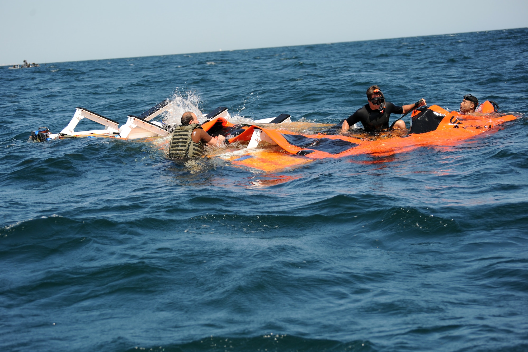 U.S. Navy Special Warfare boat operators from Special Boat Team 20 secure the platform in the Gulf of Mexico April 26, 2010. The platform held an inflatable boat from SBT-20, home-ported at Joint Expeditionary Base Little Creek, Va., and was dropped into the ocean by an MC-130H assigned to the 15th Special Operations Squadron at Hurlburt Field, Fla., as part of joint training conducted by the maritime training division of the 1st Special Operations Support Squadron Range Support Flight from Hurlburt Field. (DoD photo by U.S. Air Force Senior Airman Matthew Loken)