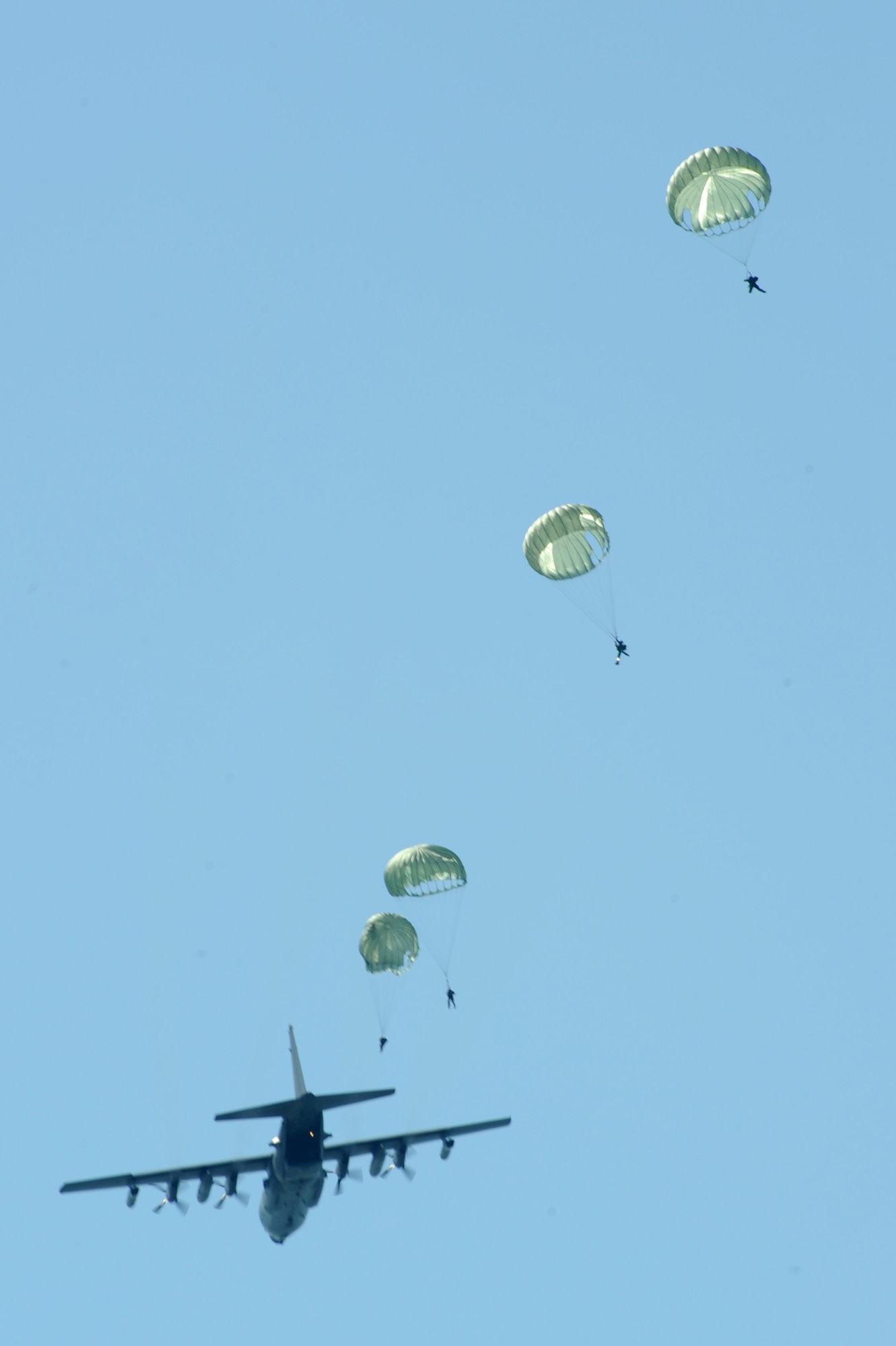 U.S. Navy Special Boat Team 20 members parachute out of an MC-130H assigned to the 15th Special Operations Squadron at Hurlburt Field, Fla., over the Gulf of Mexico April 26, 2010. SBT-20, home-ported at Joint Expeditionary Base Little Creek, Va., and the 15th SOS participated in joint training conducted by the maritime training division of the 1st Special Operations Support Squadron Range Support Flight from Hurlburt Field. (DoD photo by U.S. Air Force Airman Caitlin O'Neil-McKeown)