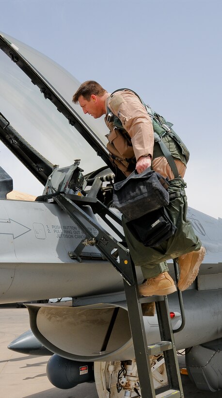 Lt.Col. Bradford "Francis" Everman, 332 Expeditionary Fighter Squadron Commander, steps up to board an F16C+ Fighting Falcon prior to departing on a Combat Air Patrol from Joint Base Balad, Iraq on April 28, 2010. Colonel Everman is also a Flight Commander at the 177th Fighter Wing, New Jersey Air National Guard, located in Egg Harbor Township, NJ.  (U.S. Air Force photo/Master Sgt. Andrew J. Moseley/Released)