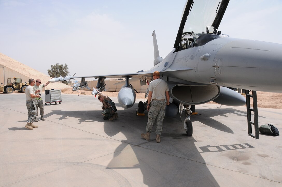 Lt.Col. Bradford "Francis" Everman, 332 Expeditionary Fighter Squadron Commander, performs pre-flight checks on an F16C+ Fighting Falcon prior to departing on a Combat Air Patrol from Joint Base Balad, Iraq on April 28, 2010. Colonel Everman is also a Flight Commander at the 177th Fighter Wing, New Jersey Air National Guard, located in Egg Harbor Township, NJ.  (U.S. Air Force photo/Master Sgt. Andrew J. Moseley/Released)