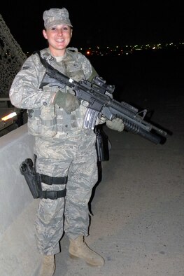 U.S. Air Force Airman 1st Class Jessica Hill, 387th Expeditionary Security Forces Squadron entry controller, guards the entrance to an undisclosed air base in Southwest Asia March 31, 2010. (U.S. Air Force photo by Capt. Mollie Robinson/Released)