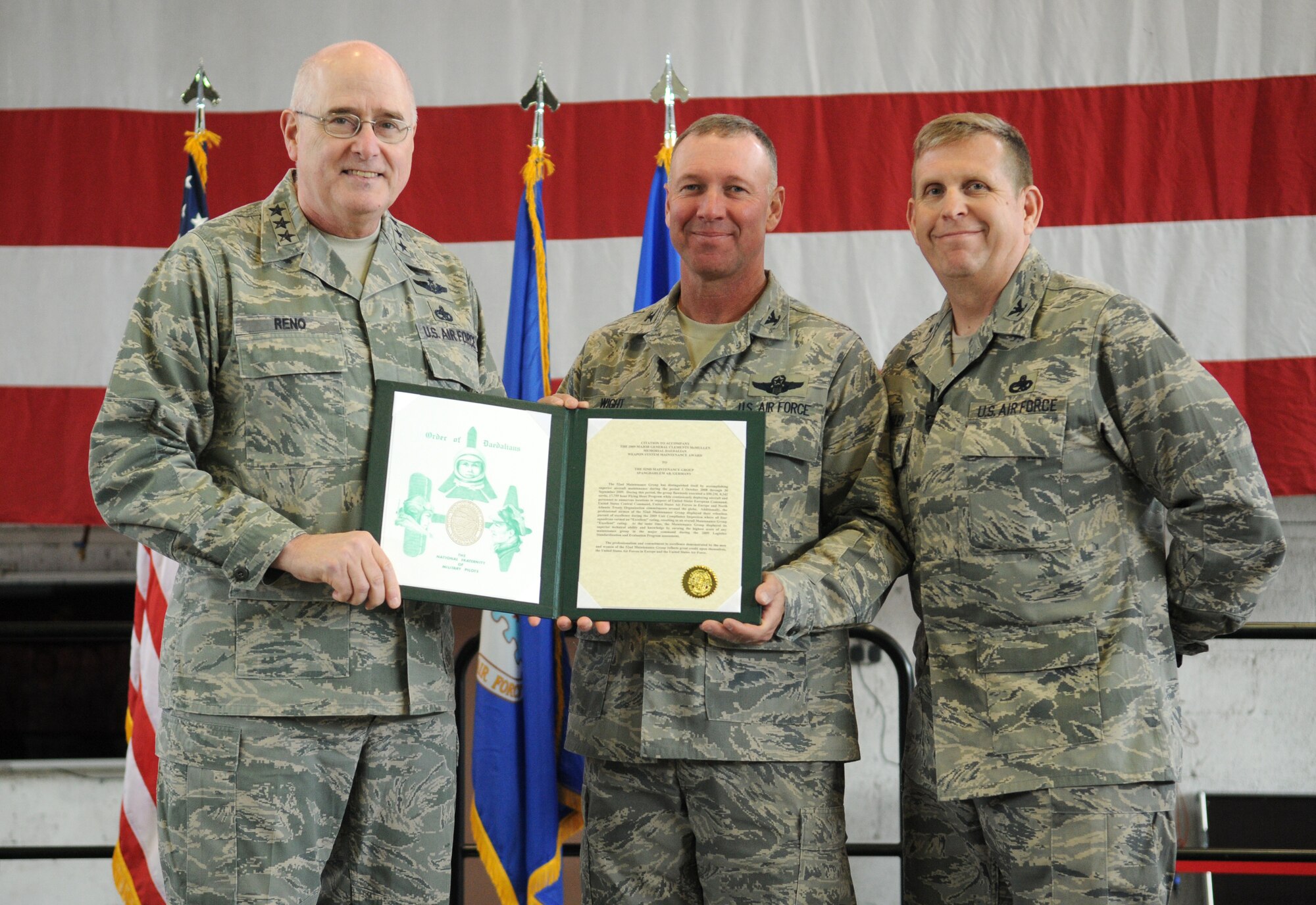SPANGDAHLEM AIR BASE, Germany -- Lt. Gen. Loren Reno, Deputy Chief of Staff for Logistics, Installations and Mission Support, presents the 2009 Maj. Gen. Clements McMullen Memorial Daedalian Weapons System Maintenance Award to Col. Tip Wight, 52nd Fighter Wing commander, and Col. John Morley, 52nd Maintenance Group commander, during his visit to Spangdahlem May 5. The 52nd MXG was recognized as the best maintenance group in the Air Force. (U.S. Air Force photo/Senior Airman Nathanael Callon)