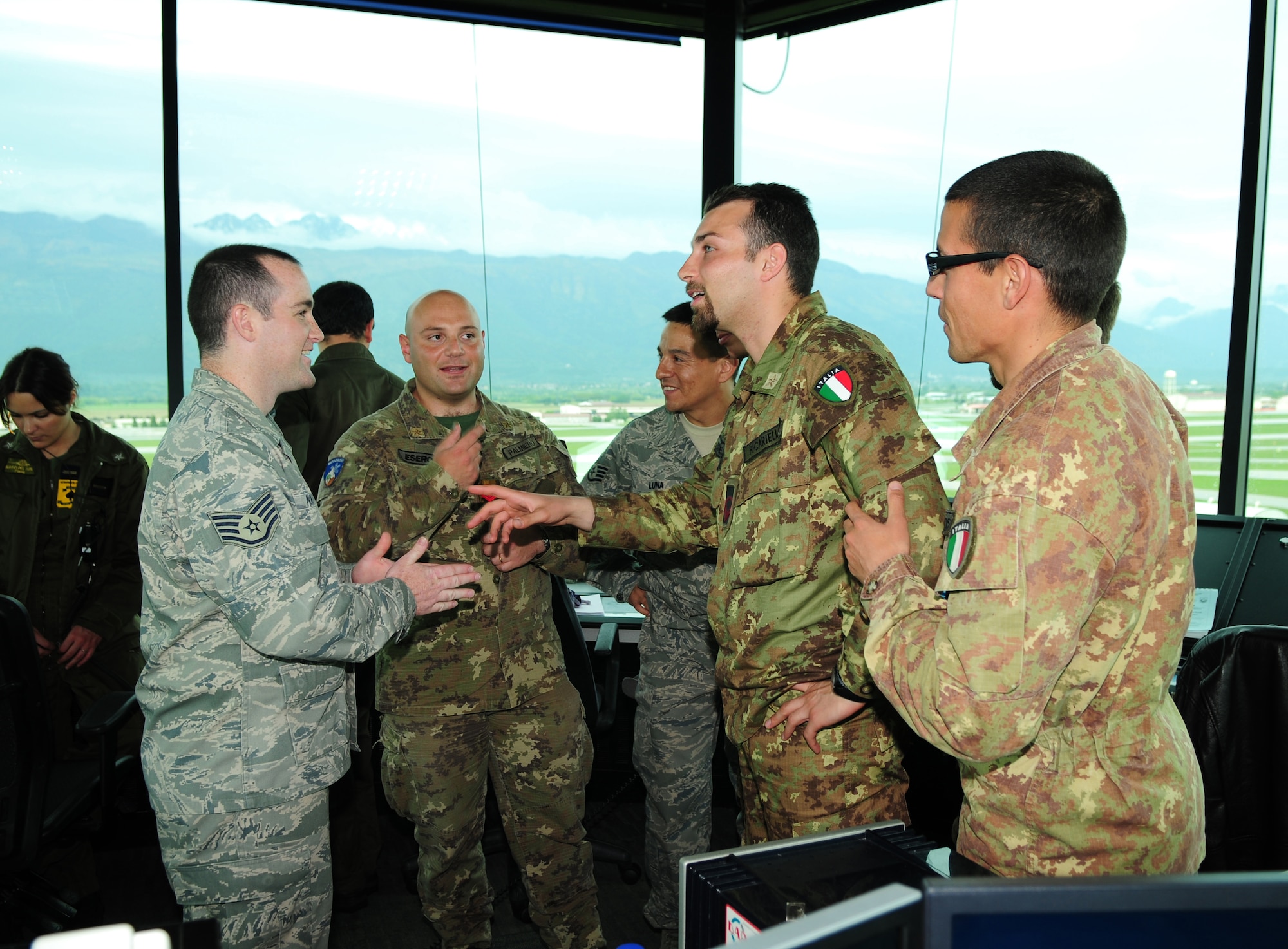 Staff Sgt. Steven Mohan, 31st Operational Support Squadron Air Traffics Control journeyman, gives a tour of the Aviano control tower during Project Partnership on May 5. Sergeant Mohan explained to members of the G3 Southern Europe Task Force that every day, military aircraft take off and land all over the world. It is the job of air traffic controllers to monitor these aircraft in order to prevent accidents.  (U.S. Air Force photo/ Staff Sgt. Taylor L. Marr)