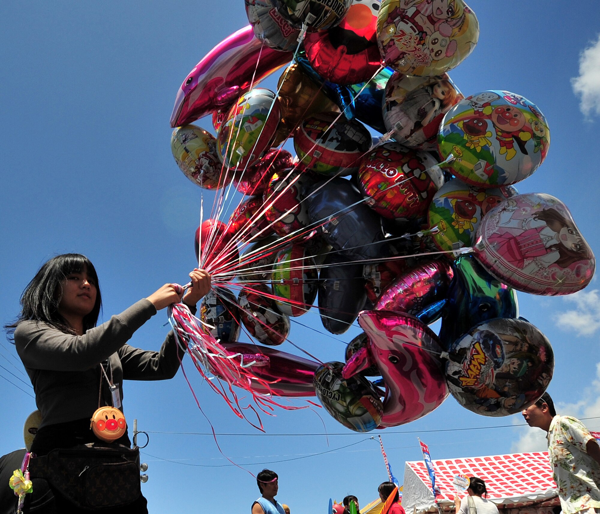Dozens of local vendors sold souvenirs to patrons attending the 36th Annual Naha Dragon Boat Races in Naha City May 5. The races were part of a larger festival where people could buy Okinawan foods and souvenirs and enjoy fairground rides along the waterfront. (Air Force/Staff Sgt. Jason Lake)