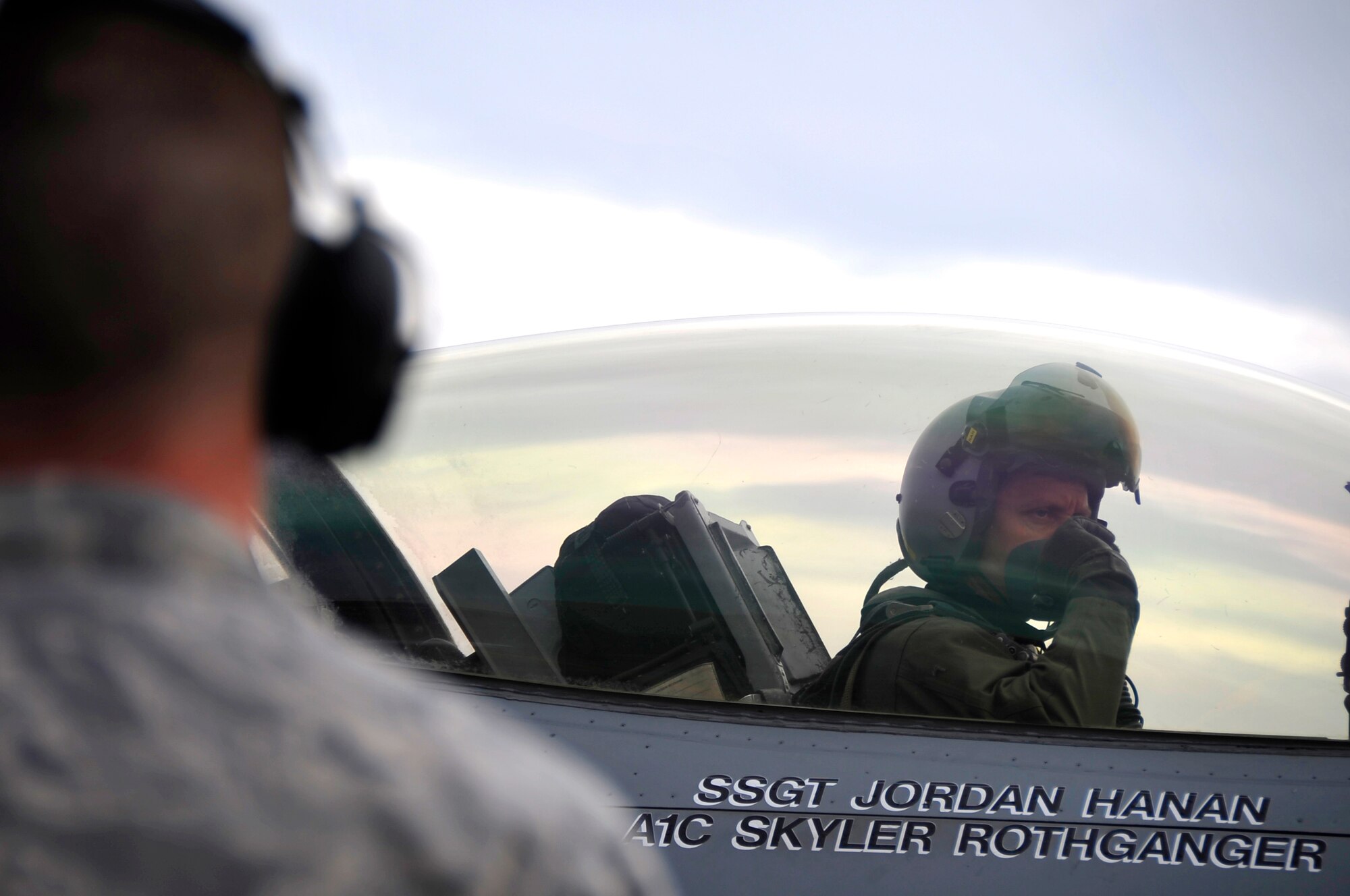 MISAWA AIR BASE, Japan -- Lt. Col. Aaron Steffens, 14th Fighter Squadron commander, talks with his crew chief before his departure to the Republic of Korea May 7. Lt. Col. Steffens and the 14th Fighter Squadron deployed to the ROK in an effort to maintain regional stability. (U.S. Air Force photo/Staff Sgt. Chad C. Strohmeyer)