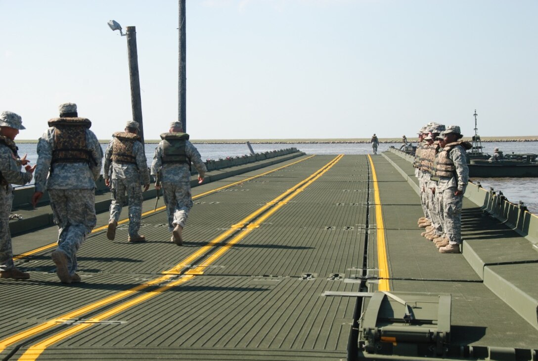 Army Maj. James S. Slaven of the Louisiana National Guard’s 205th Engineer Battalion inspects a 300-foot improved ribbon bridge built by the 2225th Multi-Role Bridge Company out of Marrero, La., at the Frank Campo Marina in Shell Beach, La., May 6, 2010. U.S. Army photo by Sgt. Michael L. Owens