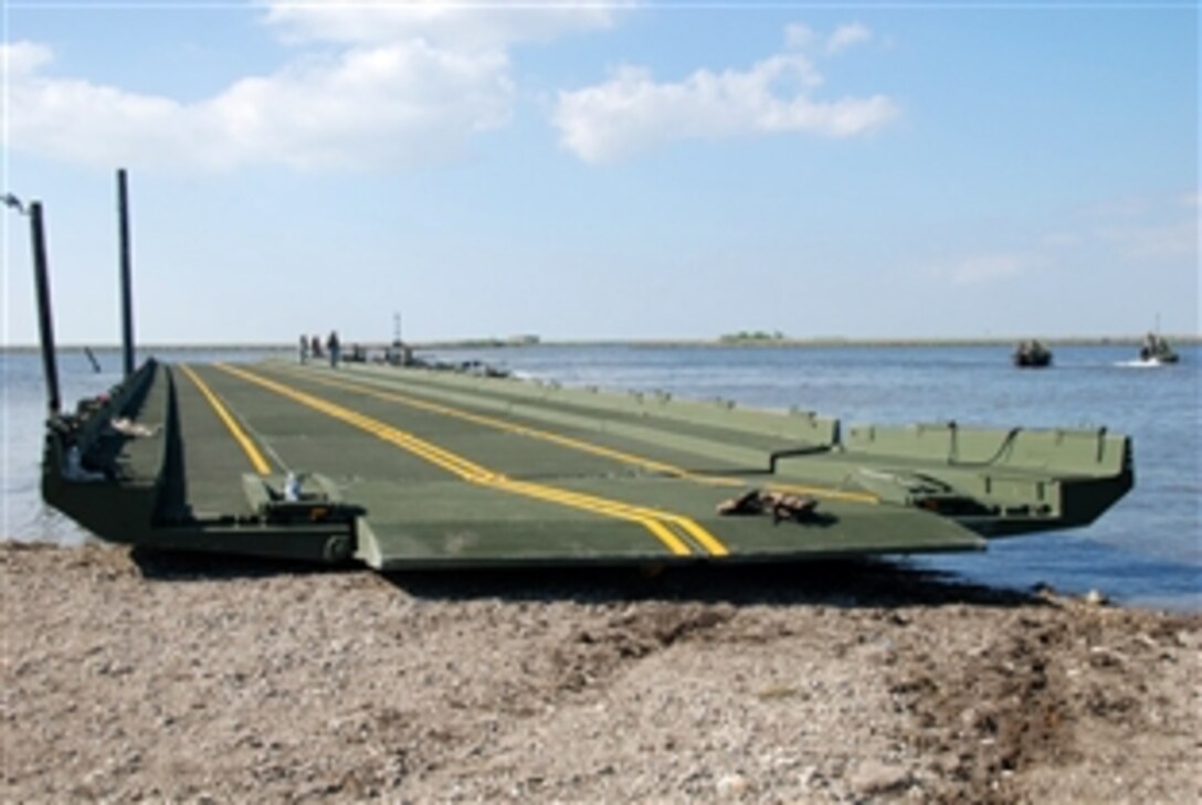 The Louisiana National Guard’s 2225th Multi-Role Bridge Company, out of Marrero, La., construct a 300-foot improved ribbon bridge at the Frank Campo Marina in Shell Beach, La., May 6, 2010, to serve as a temporary wharf for oil spill boom distribution in St. Bernard Parish.  
