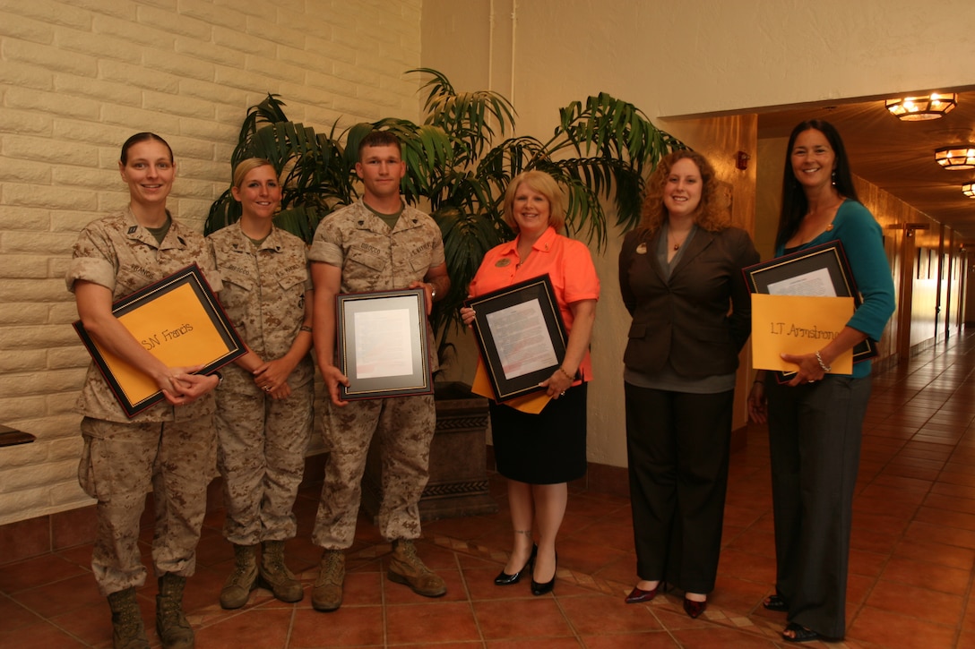 The winners of the Military Spouse Appreciation Day Essay Contest are: 1st LAR: Lt Paul Armstrong (Michelle King (FRO) receive the award on the Chaplain & his spouses behalf), 7th ESB: Cpl Heather DiRocco (Sgt Michael DiRocco Jr (spouse) attended also), 1MARDIV: MGySgt Paul Hoffman, Tina Hoffman (spouse) and Amber Hoffman (daughter) received the award, CLR-15-Supply BN: LSSN Lola Francis