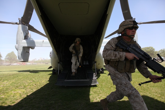 Marines with Company K, 3rd Battalion, 24th Marine Regiment, storm out of an MV-22 Osprey piloted and crewed by Marines with Marine Medium Tiltrotor Squadron 264 during a Marine Air-Ground Task Force demonstration at Joe Moakly Park in South Boston May 7, 2010. The Marines are rehearsing for a full-on assault May 8 at the park where they will demonstrate to Bostonians the capabilities of a MAGTF.