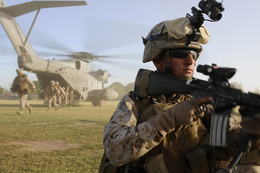 Lance Cpl. Francisco A. Rivera, rifleman with 1st Battalion, 1st Marine Regiment, guards the perimeter of a landing zone during a noncombatant evacuation operation exercise at the West Wetlands Park in Yuma, Ariz., on May 7, 2010. The exercise is part of the current Weapons and Tactics Instructor course being held at the Marine Corps Air Station in Yuma. The city of Yuma regularly allows the Marines to hold exercises within its parks, which adds realism for the students. Since the Korean War, the Marine Corps has conducted at least 16 noncombatant evacuations, the most recent in Lebanon in 2006. Many of the pilots involved were trained in Yuma, said Col. Gary Thomas, commanding officer of Marine Aviation Weapons and Tactics Squadron 1, which teaches the course. Rivera is a 20-year-old native of Anaheim, Calif. The battalion is based in Camp Pendleton in California, and is training in Yuma for an upcoming deployment.