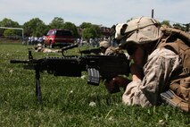 Cpl. Andrew Fields, a Terre Haute, Ind., native and an assaultman with Company K, 3rd Battalion, 24th Marine Regiment, helps provide security around a MV-22 Osprey landing site during a Marine Air-Ground Task Force demonstration at Joe Moakley Park in South Boston May 7, 2010. The exercise was a practice run for a full demonstration May 8 at Carson Beach during Marine Week Boston.