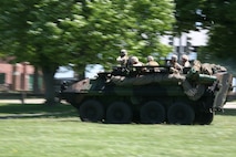 Marines from 4th Light Armored Reconnaissance Battalion ride in a Light Armored Vehicle to provide ground security in preparation for two MV-22B Ospreys landing at Moakley Park in Boston, Mass., May 7, 2010, during a Marine Air-Ground Task Force demonstration. Marines demonstrated how a MAGTF works as part of Marine Week to help increase the public awareness of the Marine Corps' way of life.