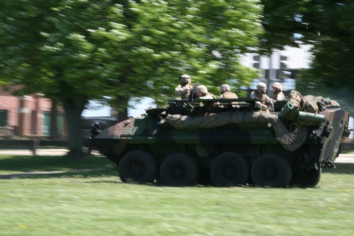 Marines from 4th Light Armored Reconnaissance Battalion ride in a Light Armored Vehicle to provide ground security in preparation for two MV-22B Ospreys landing at Moakley Park in Boston, Mass., May 7, 2010, during a Marine Air-Ground Task Force demonstration. Marines demonstrated how a MAGTF works as part of Marine Week to help increase the public awareness of the Marine Corps' way of life.