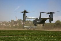 Two MV-22B Ospreys with Marine Medium Tiltrotor Squadron 264 land at Moakley Park in Boston, Mass., May 7, 2010, as Marines from Company K, 3rd Battalion, 24th Marine Regiment, 4th Marine Division, offload the Osprey to provide ground security during a Marine Air-Ground Task Force demonstration. Marines demonstrated how a MAGTF works as part of Marine Week to help increase the public awareness of the Marine Corps' way of life.
