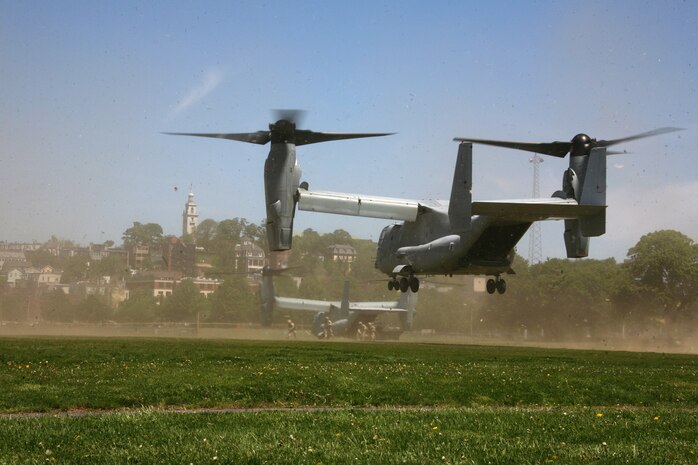 Two MV-22B Ospreys with Marine Medium Tiltrotor Squadron 264 land at Moakley Park in Boston, Mass., May 7, 2010, as Marines from Company K, 3rd Battalion, 24th Marine Regiment, 4th Marine Division, offload the Osprey to provide ground security during a Marine Air-Ground Task Force demonstration. Marines demonstrated how a MAGTF works as part of Marine Week to help increase the public awareness of the Marine Corps' way of life.