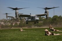 Marines from Company K, 3rd Battalion, 24th Marine Regiment, 4th Marine Division, provide ground security for two MV-22B Ospreys with Marine Medium Tiltrotor Squadron 264 during a Marine Air-Ground Task Force demonstration, at Moakley Park in Boston, Mass., May 7, 2010. Marines demonstrated how a MAGTF works as part of Marine Week to help increase the public awareness of the Marine Corps' way of life.