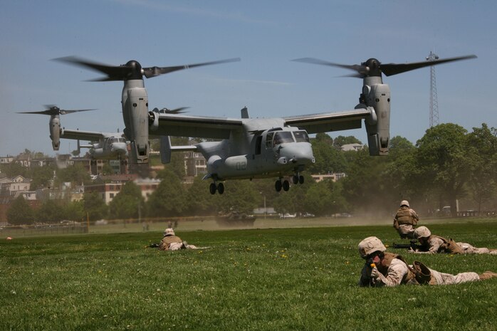 Marines from Company K, 3rd Battalion, 24th Marine Regiment, 4th Marine Division, provide ground security for two MV-22B Ospreys with Marine Medium Tiltrotor Squadron 264 during a Marine Air-Ground Task Force demonstration, at Moakley Park in Boston, Mass., May 7, 2010. Marines demonstrated how a MAGTF works as part of Marine Week to help increase the public awareness of the Marine Corps' way of life.