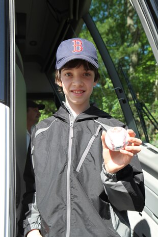 Michael Taggart, 12, shows off the baseball Mike Lowell, Boston Red Sox third baseman, autographed for him before a flight over Boston on an MV-22 Osprey during Marine Week Boston. Marine Week is an opportunity to share the Corps' culture, history and traditions and raise awareness about the Corps' value to the nation.