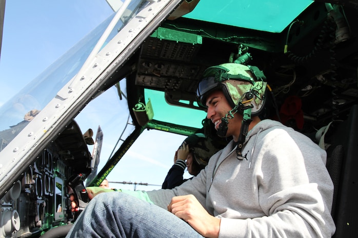 Jacoby Ellsbury, outfielder for the Boston Red Sox, ::r::::n::checks out the cockpit of a CH-53 Sea Stallion, during Marine Week Boston. More than 900 Marines descended on Boston for Marine Week, May 3-9, celebrating the contributions and support Boston has shown for men and women in uniform.