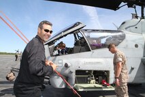 Mike Lowell, third baseman for the Boston Red Sox, and his children enjoy a static display before taking flight in an MV-22 Osprey, May 7, 2010.  Lowell and his teammate, Jocoby Ellsbury, outfielder, visited the base to show their appreciation to the Marines and take a tour of Boston from the sky.  More than 900 Marines descended on Boston for Marine Week, May 3-9, to share the Corps' culture, history and traditions with Bostonians.