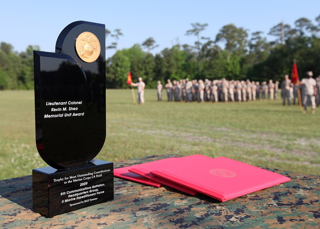 Marines with 8th Communications Battalion, II Marine Expeditionary Force stand ready on Soifert Field Parade Deck aboard Camp Lejeune, N.C., to receive the 2009 Lt. Col. Kevin M. Shea Memorial Unit Award, May 7, 2010. The battalion not only won the unit award, but three of the battalion’s Marines also received individual awards for making outstanding contributions to the Marine Corps in the field of Command, Control, Communications and Computers.