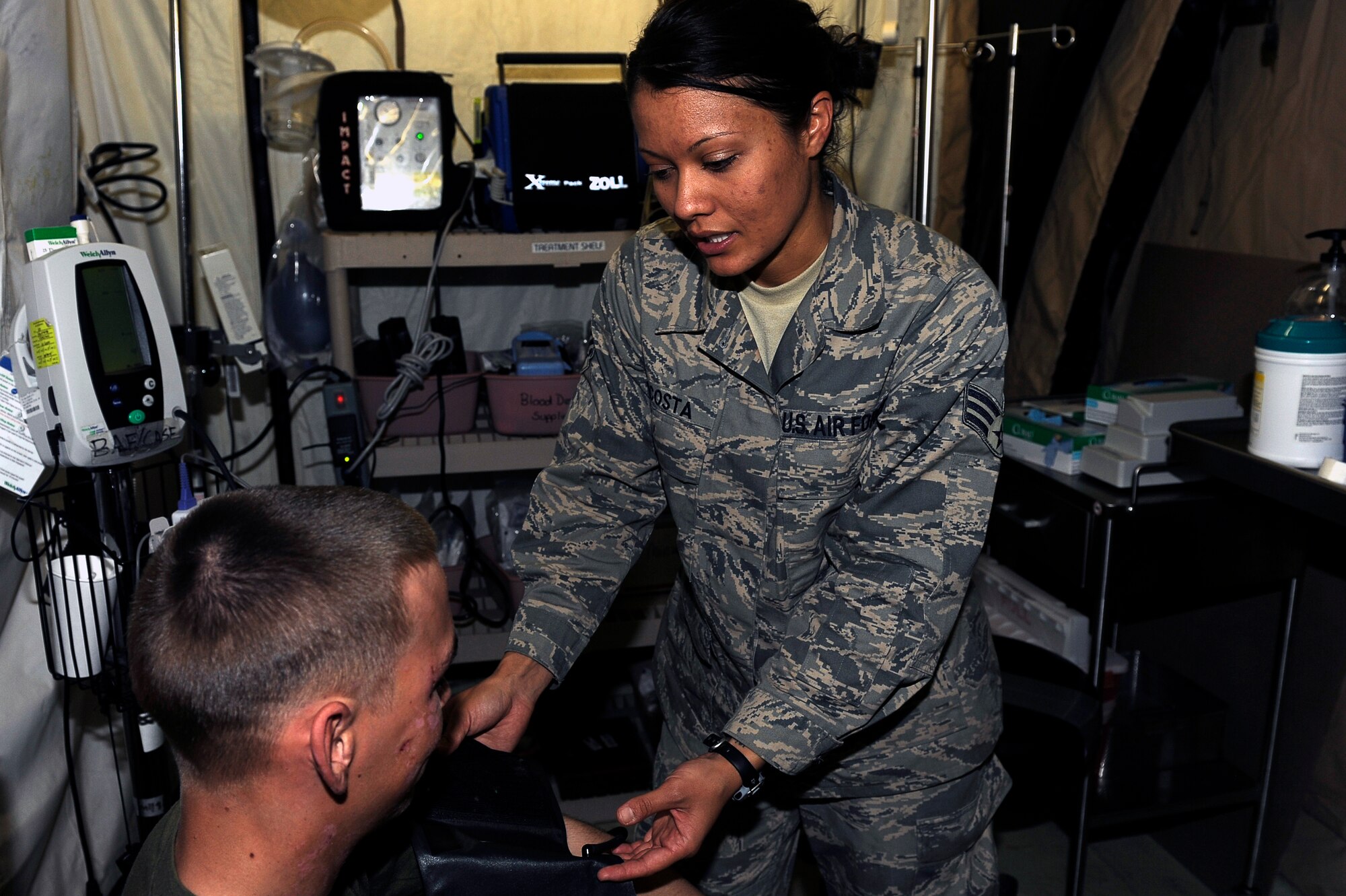 Senior Airman Danielle Acosta is this week’s 455th Air Expeditionary Wing Warrior of the Week. She is an aerospace medicine technician deployed from the 349th Aeromedical Staging Squadron, Travis Air Force Base, Calif. and is a Tracy, Calif. native. 
Airman Acosta works for the Contingency Aeromedical Staging Facility located at the Craig Joint Theater Hospital. She provides support and continuity of medical care for patient movement. Airman Acosta also provides patient reception and treatment while they are at the CASF. She also directs mission launch and recovery of patients to and from a variety of coalition aircraft. 
Airman Acosta was surprised she had even been nominated for the wing honor. “We do our job to do it not for the recognition.”
She also explained the importance of her job saying, if it was not for the work completed by her and her team members at the CASF, critically wounded patients may have a more difficult time getting to life saving medical care. 
Her supervision highlighted some of her accomplishments here by saying, Airman Acosta has performed exemplary as the Mission NCO (“Bulldog”) for Aeromedical Evacuation (AE) missions for the Contingency Aeromedical Staging Facility. Her facility serves as the hub for all patient movement within the entire Afghanistan AOR and evacuation to locations outside of the theater of operations.  This week, she spearheaded the team that launched and recovered 17 AE missions (3 ISAF missions), involving 117 patients to include 19 critically injured and this rotation’s first ever K-9 “working-dog” patient. She was chosen to be the distinguished visitor briefer for the CASF briefing 2 distinguished visitor tours, including the new 455 AEW  Commander. Highly self motivated, she took it upon herself to reorganize the CASF’s storage container to capitalize on the storage space available for over 7,000 pounds of patient baggage, medical supplies and donated items to make room for additional items to support the sur