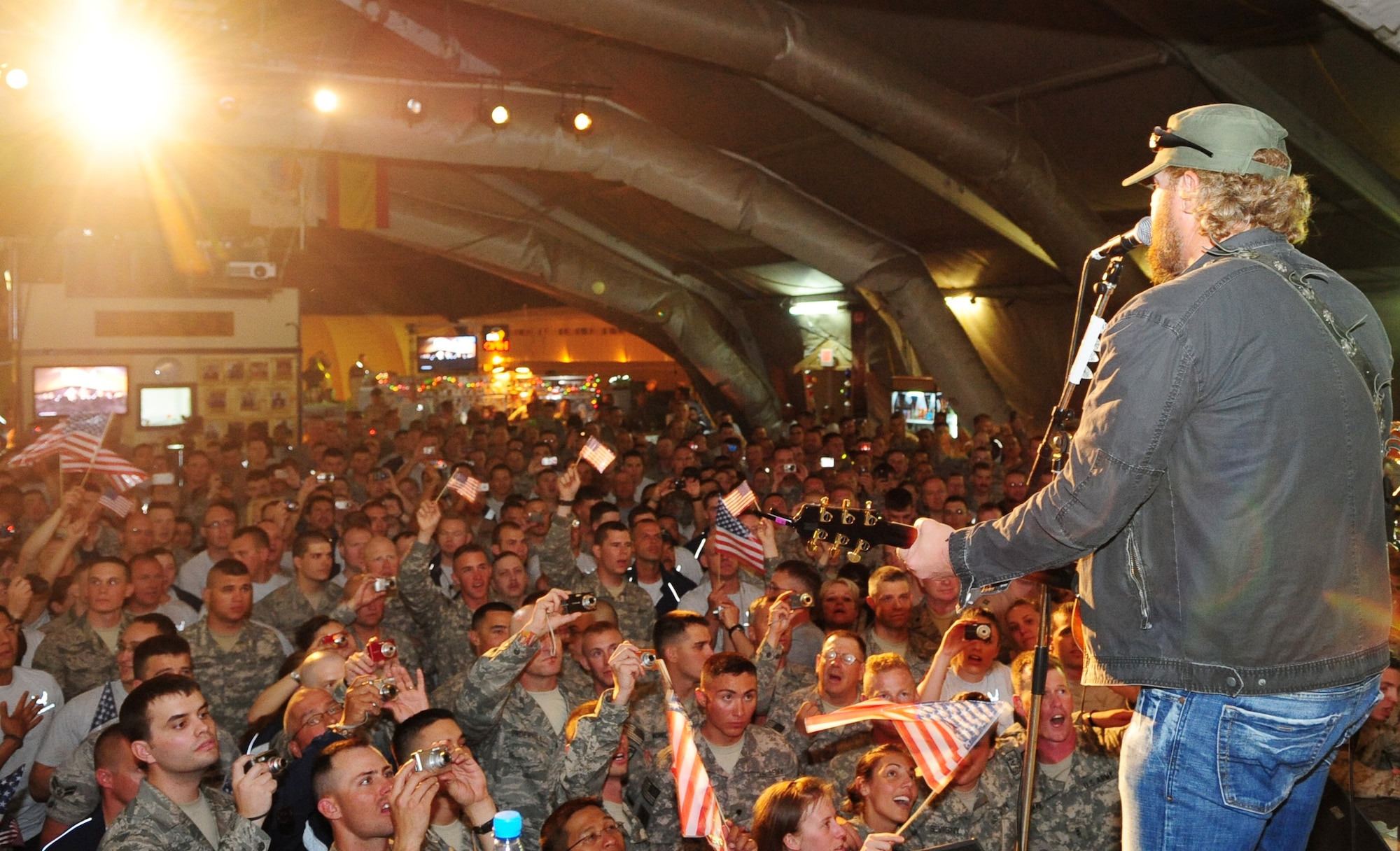 Toby Keith entertains Airmen, Soldiers, Sailors, Marines, DoD employees, contract civilians, and coalition forces during a free USO concert at Pete's Place May 7, 2010. (U.S. Air Force photo/ Senior Airman Nichelle Anderson) 