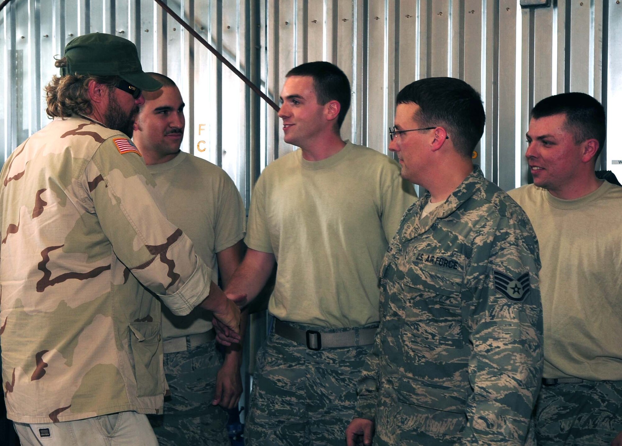 Toby Keith greets Airmen from the Transit Center at Manas, Kyrgyzstan, during a tour here May 7, 2010. (U.S. Air Force photo/Staff Sgt. Carolyn Viss)