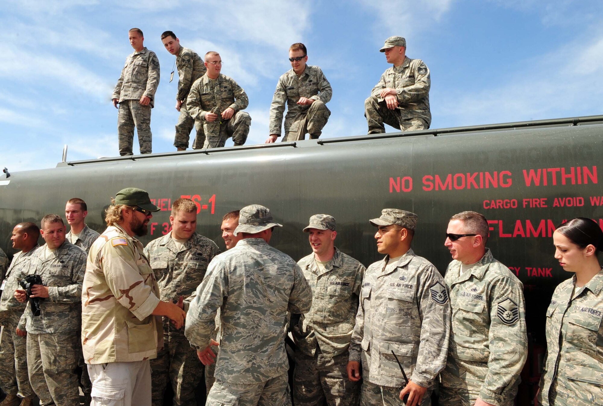 Toby Keith greets 376th Expeditionary Logistics Readiness Squadron petroleum, oil and lubricants Airmen from the Transit Center at Manas, Kyrgyzstan, during a USO tour here May 7, 2010. (U.S. Air Force photo/Staff Sgt. Carolyn Viss)