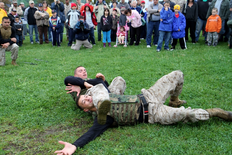 Sgt. Steven N. Richardson performs an arm-bar takedown technique on Sgt. Andrew B. Chavis during a Marine Corps Martial Arts Program demonstration at Marine Week family day at Joe Moakley Park in Boston, Mass., May 8, 2010. Chavis and Richardson are both martial arts instructor trainers from Marine Corps Base Quantico, Va.