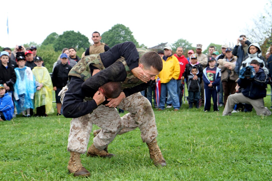 Sgt. Andrew B. Chavis, puts Sgt. Steven N. Richardson in a headlock during a Marine Corps Martial Arts Program demonstration at Marine Week family day at Joe Moakley Park in Boston, Mass., May 8, 2010. Chavis and Richardson are both martial arts instructor trainers from Marine Corps Base Quantico, Va.