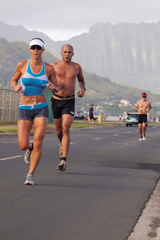 Runners endure the final 3.1-mile run of the Commanding Officer’s Fitness Series’ Sprint Triathlon at Marine Corps Base Hawaii, May 8. The event was hosted by Headquarters Battalion.
