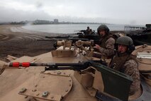 Cpl. Chris O'Quinn and Sgt. K. C. Warren, both natives of Louisville, Ky., serving with Company E, 4th Tank Battalion, are prepared to storm Carson Beach in South Boston for an assault demonstration put on by Marines in Support of Marine Week Boston May 8, 2010.