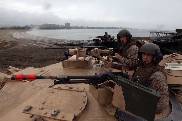 Cpl. Chris O'Quinn and Sgt. K. C. Warren, both natives of Louisville, Ky., serving with Company E, 4th Tank Battalion, are prepared to storm Carson Beach in South Boston for an assault demonstration put on by Marines in Support of Marine Week Boston May 8, 2010.
