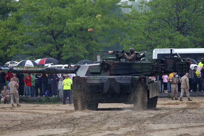 Marines of 3rd Battalion, 24th Marines, storm Carson beach at Joe Moakley Park, Boston as part an amphibious assault vehicle demonstration during Marine Week Boston, May 8, 2010. Marine Week provides an opportunity to increase public awareness of the Marine Corps' value to our nation's defense and to preserve and mature the Corps' relationship with the American people.
