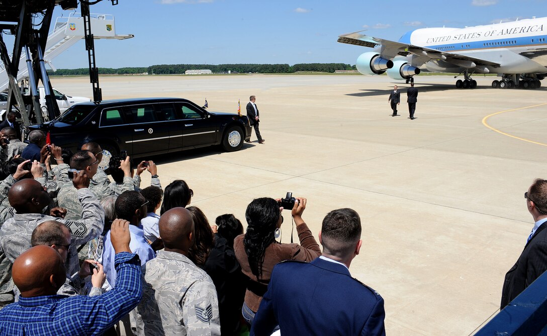 LANGLEY AIR FORCE BASE, Va. – Col. Donald E. Kirkland, 633d Air Base Wing commander, and spectators watch as President Barack Obama departs May 9. President Obama delivered the commencement address at nearby Hampton University, emphasizing the importance of education and good citizenship to graduates. (U.S. Air Force photo/Staff Sgt. Christina M. Styer)