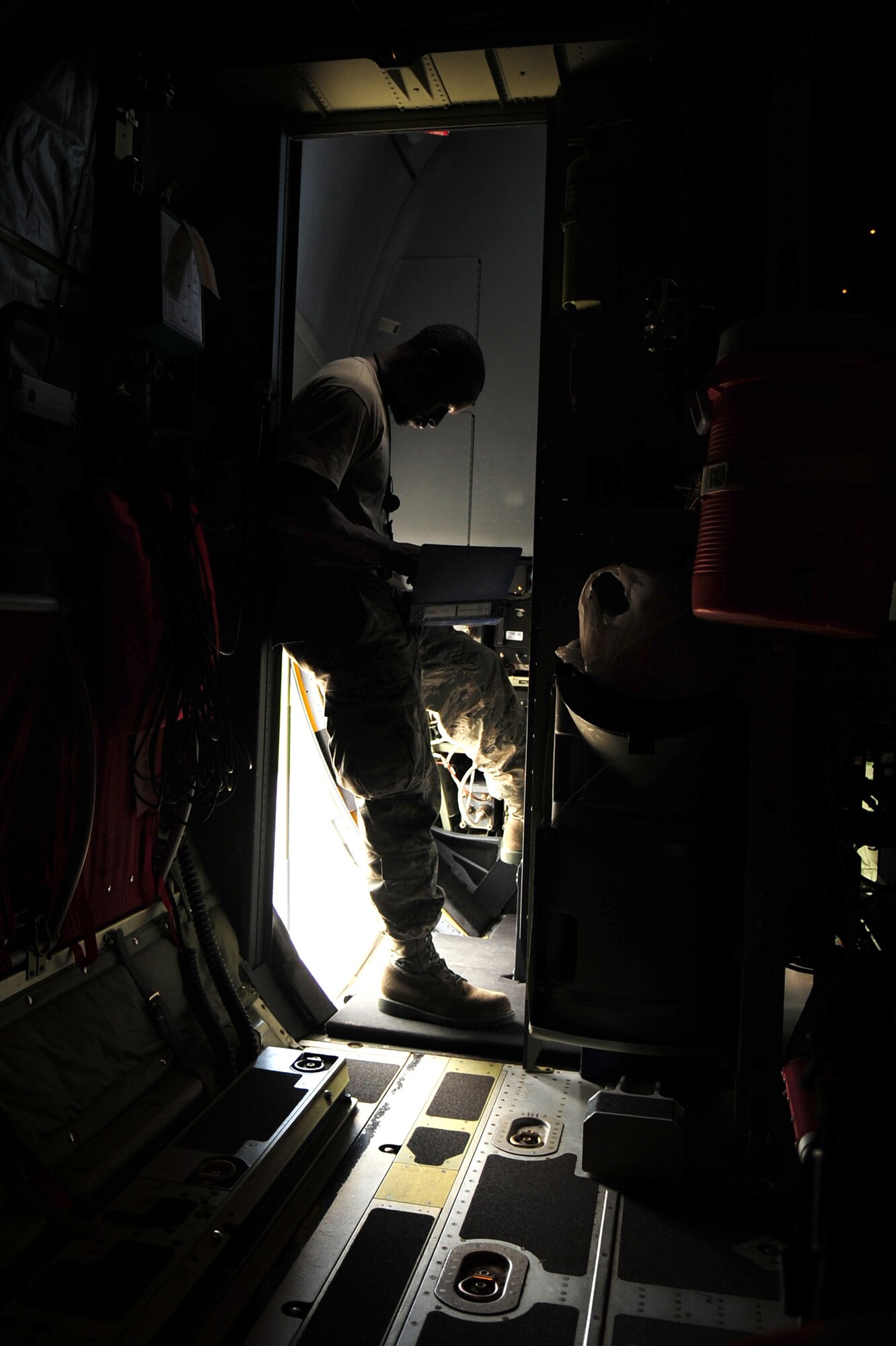 U.S. Air Force Senior Airman Travis Dale, 86th Aircraft Maintenance Squadron crew chief, reviews a check list on a C-130J, in preparation for Romanian Air Force members for a jump during the joint exercise Carpathian Summer, Otopeni Airlift Base, Romania, May 10, 2010. Carpathian Summer 2010 was an exercise in which the Romanian Air Force invited members of the U.S. military to train with them on their soil and air space, to observe, firsthand, operations in action. This exercise was designed to build partnerships between these nations in an effort to work together more efficiently during real world scenarios. (U.S. Air Force Photo by Staff Sgt. Jocelyn Rich)