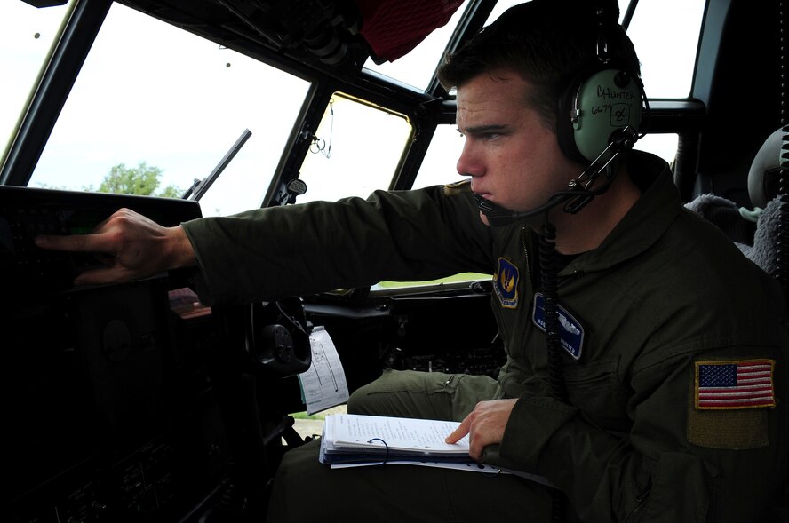 U.S. Air Force Staff Sgt. Brett Hunter, 37th Airlift Squadron loadmaster, conducts pre-flight checks on a C-130J in preparation for the joint exercise Carpathian Summer 2010, Otopeni Airlift Wing , May 10, 2010. Members of the U.S. and Romanian Air Forces joined together for a week long exercise to build partnerships and enhance proficiency in working together. (U.S. Air Force Photo by Staff Sgt. Jocelyn Rich)