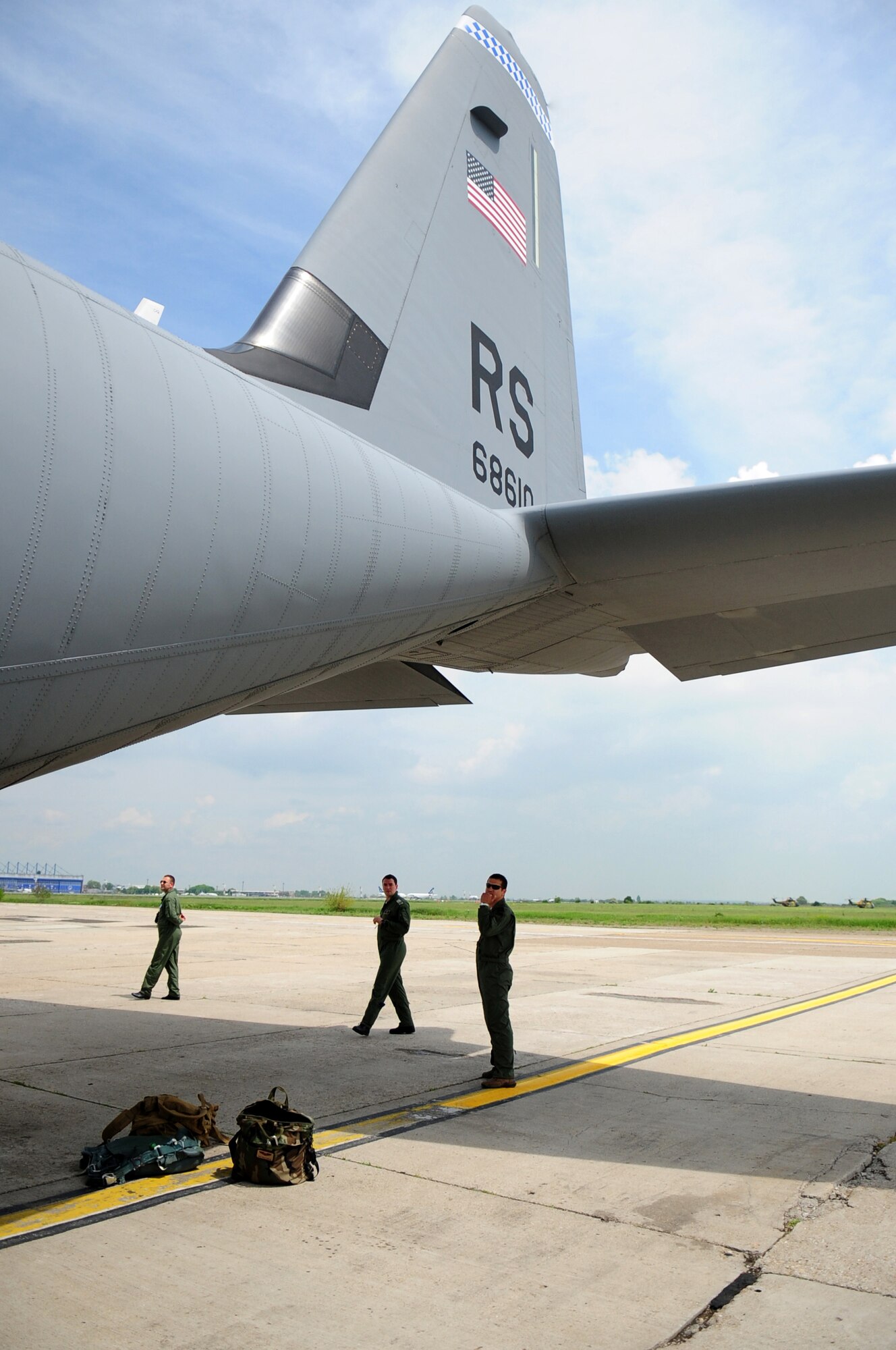 Romanian Air Force flight engineers take a look at a U.S. Air Force C-130J from Ramstein Air Base at Airlift Base Otopeni, Romania, May 10, 2010. Members of the U.S. and Romanian Air Forces joined together for a week long exercise to build partnerships and enhance proficiency in working together. (U.S. Air Force Photo by Staff Sgt. Jocelyn Rich)