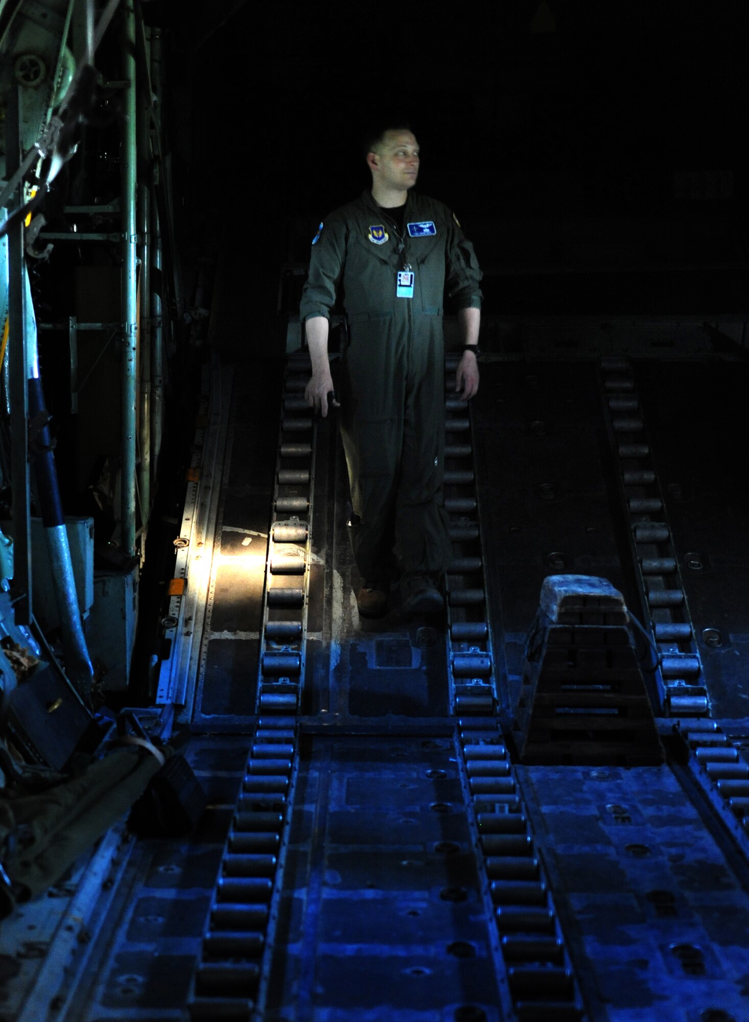U.S. Air Force Tech. Sgt. David Dais from the 37th Airlift Squadron loadmaster, tours a Romanian C-130B at Airlift Base Otopeni, Romania, May 10, 2010. Members of the U.S. and Romanian Air Forces joined together for a week long exercise to build partnerships and enhance proficiency in working together. (U.S. Air Force Photo by Staff Sgt. Jocelyn Rich)